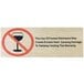 A BFM Seating black square table with synthetic teak top and a sign with black text that says "The use of tobacco products is prohibited"