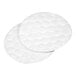 A pair of round, white textured cotton pads from a hotel and motel grooming kit.