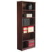 A mahogany Alera bookcase with books on shelves.