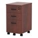 A medium cherry wooden Alera mobile file cabinet with three drawers and wheels.