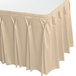 A cream Snap Drape table skirt with pleated bow tie pleats.