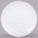 A white GET Milano melamine plate with a spiral pattern.