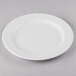 A white Libbey porcelain plate with a medium rim on a gray surface.