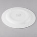 A Libbey white porcelain plate with a circular design on the rim.