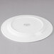 A white Libbey porcelain plate with a circular design on the rim.