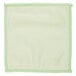 A white microfiber cloth with green stitching.