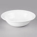 a white bowl on a gray surface