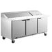 A Beverage-Air stainless steel 3 door refrigerated sandwich prep table on wheels.
