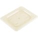 A Cambro amber plastic lid on a white surface.