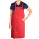 a woman wearing a red apron