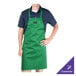 A man wearing a customized Kelly green Chef Revival bib apron.