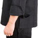 A Chef Revival black chef jacket with a chest pocket.
