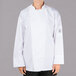 A person wearing a white Chef Revival long sleeve chef jacket with mesh back.