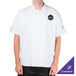 A man wearing a white Chef Revival short sleeve chef jacket.