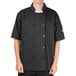 A man wearing a black Chef Revival chef coat.