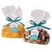 Bags of nuts and dried fruit with white scalloped tags and blue ribbons.