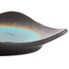 A black and brown Libbey Hakone stoneware plate with blue detailing on a table.