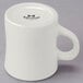A close-up of a white Tuxton diner mug with a black handle.