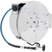 A silver and blue T&S hose reel with a hose attached.