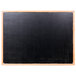 An Aarco black marker board with an oak frame.