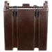A dark brown plastic Cambro soup carrier with black handles.