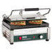 The top and bottom of a sandwich being grilled on a Waring Panini Supremo grill.
