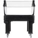 A black Carlisle portable salad bar with a clear top on a black cart.