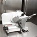 A Globe manual meat slicer on a table.