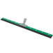 A green and black Unger AquaDozer floor squeegee with a metal handle.