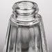 A Tablecraft clear glass salt and pepper shaker with a chrome plated lid.