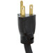 A black electrical plug with gold tips.