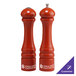 A Chef Specialties Butternut Orange pepper mill and salt shaker set with silver tops.