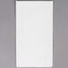 A white rectangular Hoffmaster Linen-Like guest towel in a black and white dispenser box.