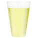 A Fineline clear plastic tumbler filled with yellow liquid on a white surface.