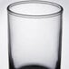 A clear Libbey Lexington juice glass with a black rim.