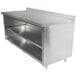 A stainless steel Advance Tabco work table with fixed midshelf and backsplash.