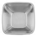 A close-up of a silver square Vollrath serving bowl.