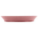 A raspberry pink round deli server with a short base.