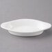 A white oval Tuxton Welsh Rarebit dish with a small rim.