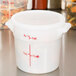 A white plastic Cambro lid with red writing.