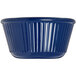 A close-up of a Carlisle cobalt blue fluted ramekin.