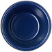 A blue fluted ramekin with a white background.