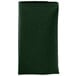 A folded dark green Intedge cloth napkin.