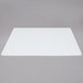A white rectangular Tablecraft flexible cutting board with a black border.