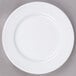 a white plate on a gray surface