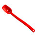 A red plastic Cambro salad bar spoon with holes.