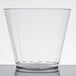 a clear plastic cup on a white surface