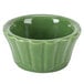 A green Festiware ramekin with a scalloped edge.