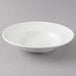 a white bowl on a gray background