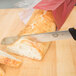 a piece of bread on a wooden surface